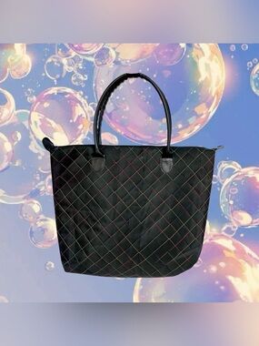 Signature Tote A black tote purse with rainbow stitches